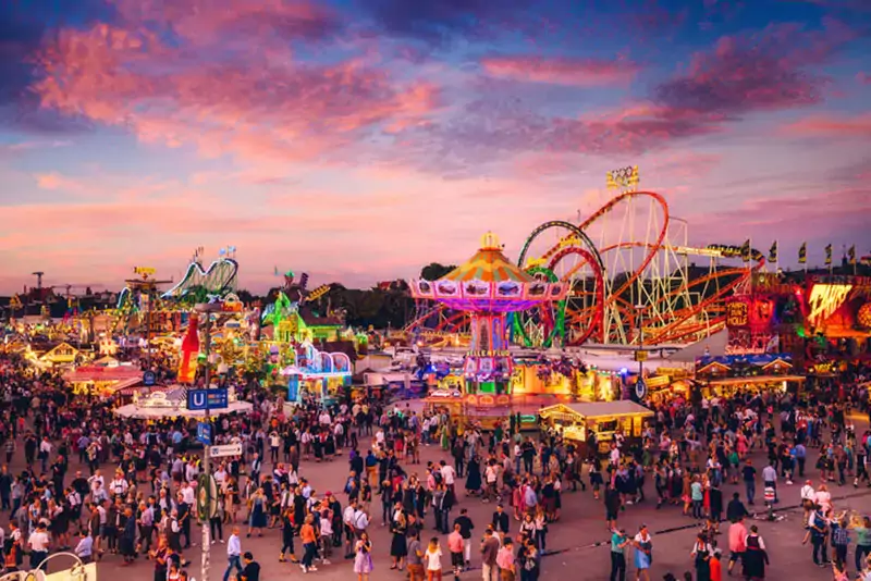 Visitors Walking Through Oktoberfest Fairgrounds, Munich, Germany