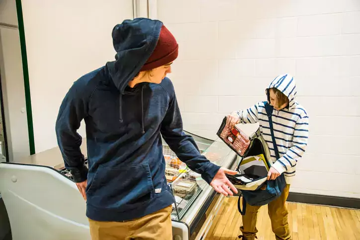 Two brothers shoplifting bacon