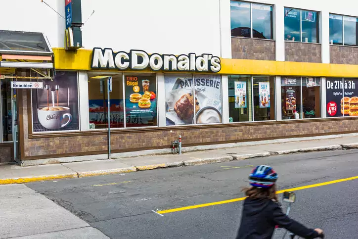 McDonalds sign and logo by St Hubert street on Rue Beaubien in Plateau neighborhood in city in Quebec region