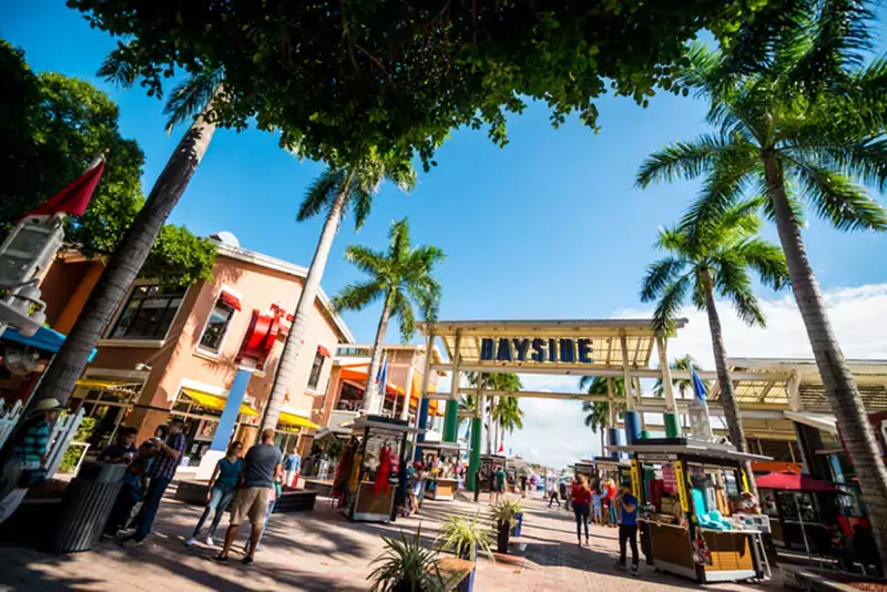 Tourists exploring Bayside Market place in Miami downtown, USA