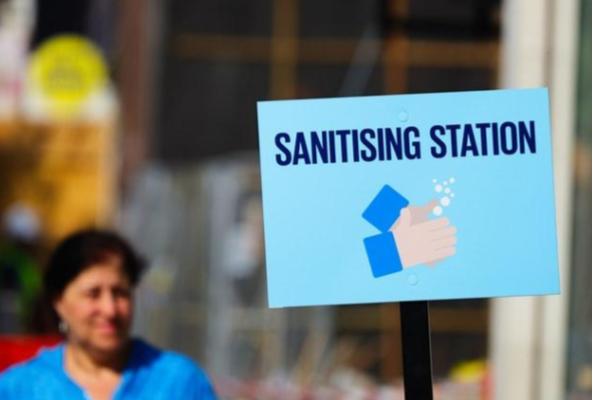 Sign for a sanitizing station