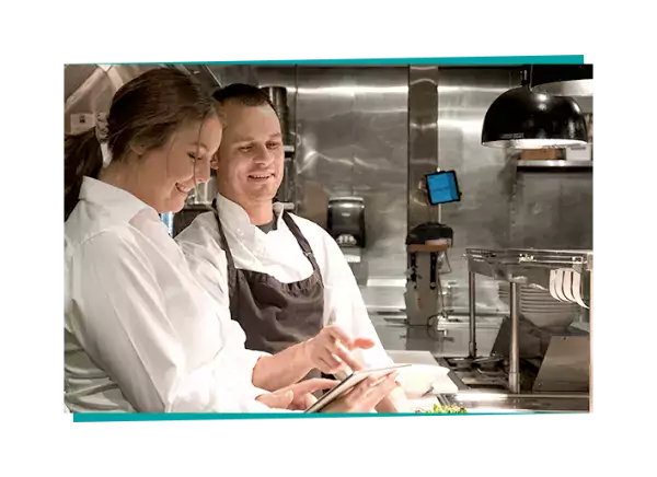 chef training a restaurant worker